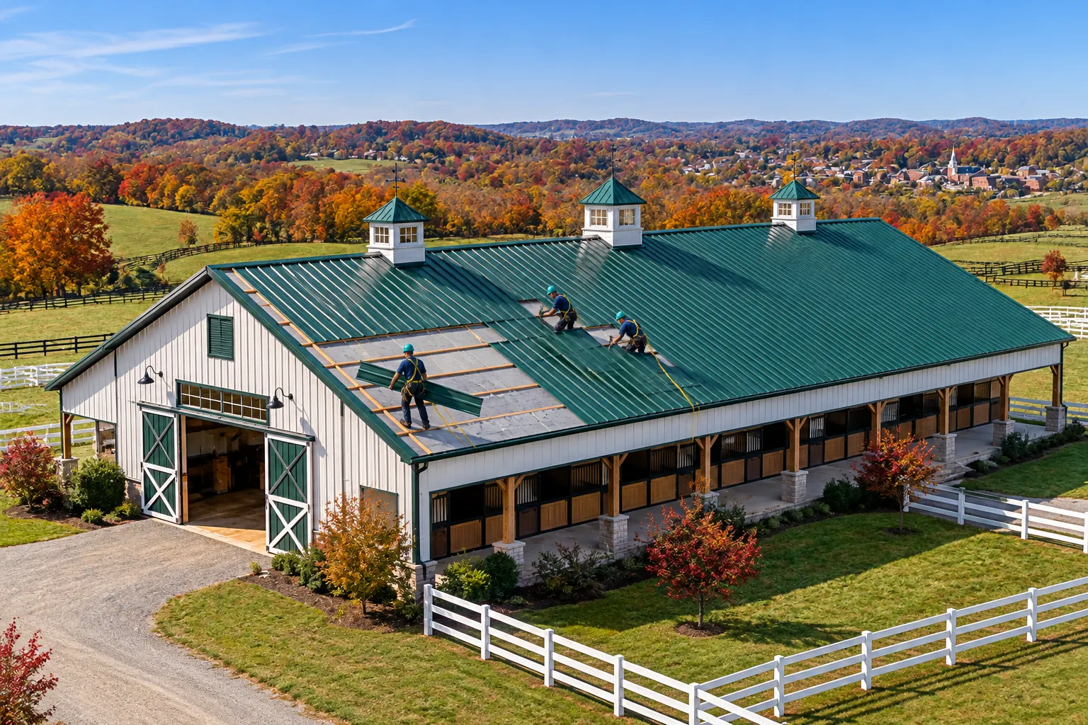 Roofers installing metal panels on a commercial building